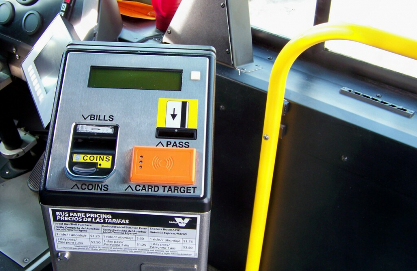 "Valley Metro bus fare box" by Nick Bastian Tempe, AZ is licensed under CC BY-ND 2.0. To view a copy of this license, visit https://creativecommons.org/licenses/by-nd/2.0/?ref=openverse.