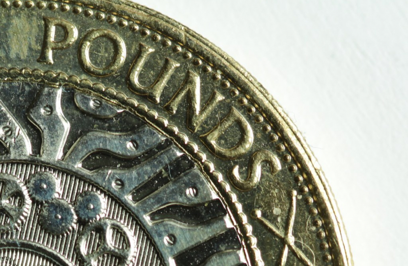 "British two pound coin (crop)" by alf.melin is licensed under CC BY-SA 2.0.