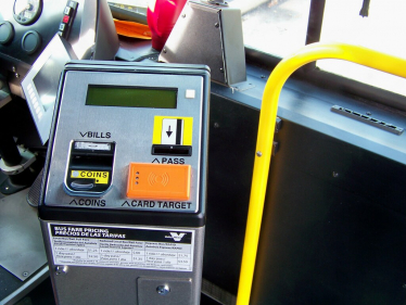 "Valley Metro bus fare box" by Nick Bastian Tempe, AZ is licensed under CC BY-ND 2.0. To view a copy of this license, visit https://creativecommons.org/licenses/by-nd/2.0/?ref=openverse.
