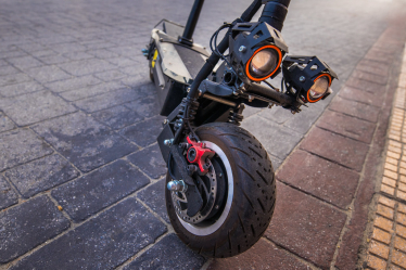 "Powerful looking e-scooter with disc brakes and twin headlights" by Ivan Radic is licensed under CC BY 2.0.